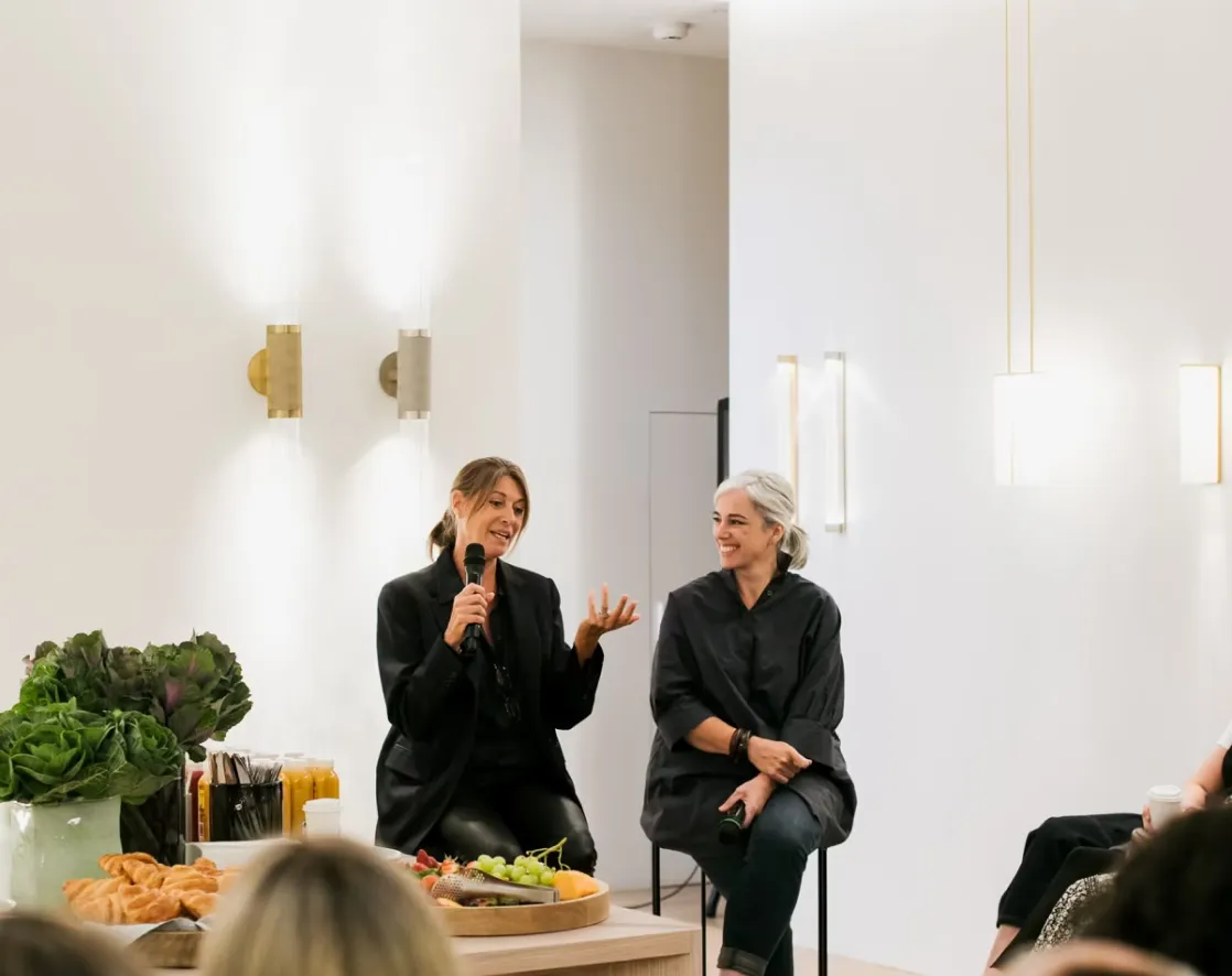 Women speaking at an event